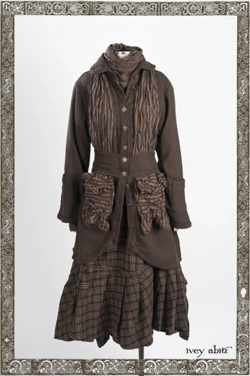 Morris Coat in Oak Wicker Woven Weave; Limbert Scarf in Oak Clever Stripe Knit; Morris Frock in Oak Brushed Plaid Weave; Lelant Neck Wrap and Arm Sleeves in Oak Puckered Knit.