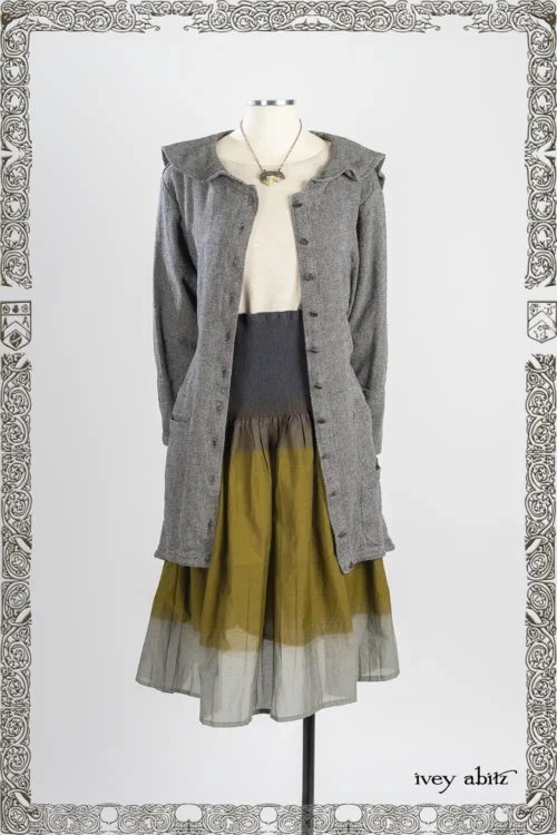 Milton Duster Coat in New Day Pebbled Weave; Heirloom Necklace; Lounging Shirt in Iron Soft and Stretchy Knit; Lillibet Skirt in New Day Crinkled Ruched Weave.