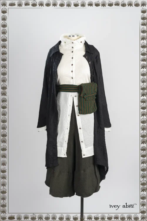 Elsie Duster Coat in Iron Pin Tucked Voile; Vanetten Shirt in Everyday Pin Tucked Voile; Campanella Culottes in Pine Green and Iron Accordion Knit; Voyage Satchel in Pine Green and Grass Embroidered Stripe