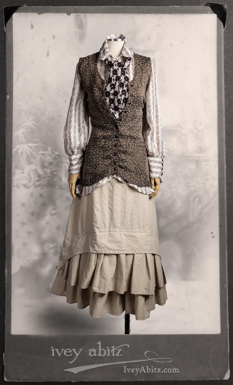 Truitt Shirt in Dignity Washed Vine Silk; Holkham Hall Necktie in Royal Embroidered Voile; Truitt Vest in Saddle Floral Puckered Weave; Everett Skirt in Uptown Raised Stripe Weave.