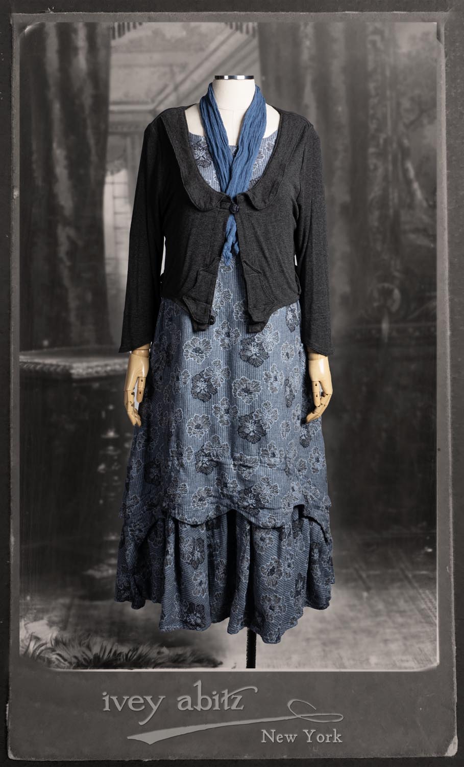 Ans Jacket in Wolfie Grey Soft Ribbed Knit; Clotaire Sash in Express Line Crinkled Weave; Heraldry Frock in Seascape Floral Weave.