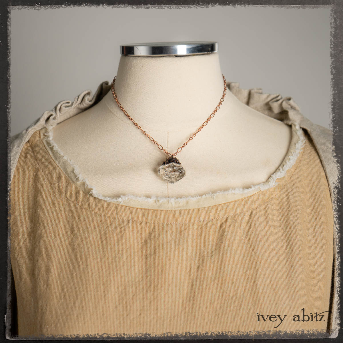 Limited Edition Blanchefleur Frock in Sun and Sand Stripe Weave; Canterbury Cardigan in Signature Sandy Lightweight Linen Knit; Fairholme Sash in Brooklyn Floral Silk Chiffon; Nouvelle Necklace.