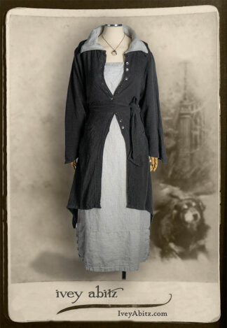 Elsie Duster Coat in Black Puckered Check Weave; Viv Frock in Foggy London Town Woven Stripe; Nouvelle Necklace.