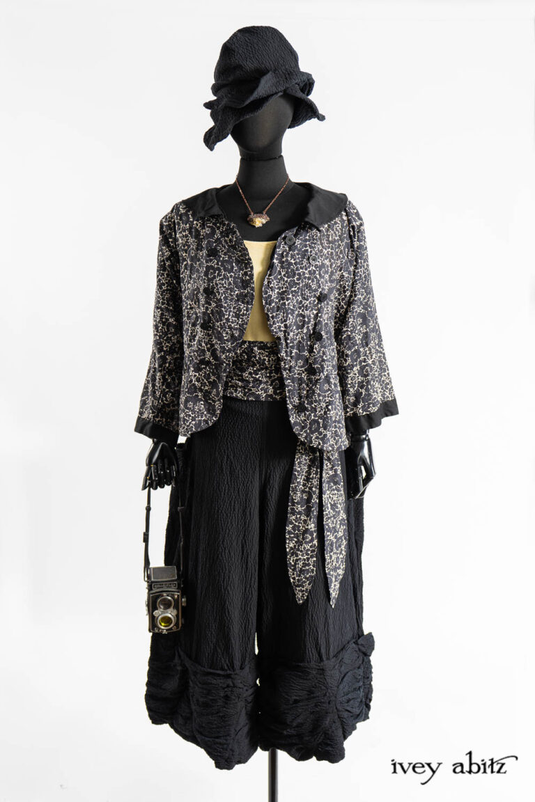 Sennen Jacket in Post Modern Floral Ethereal Weave; Cilla Camisole in Dada Silkiest Knit; Fitzgerald Trousers in Post Modern Puckered Wispy Weave; Eleanora Sash in Post Modern Floral Ethereal Weave; Hapgood Hat in Post Modern Puckered Wispy Weave; Hapgood Hat in Post Modern Puckered Wispy Weave; Renaissance Necklace.