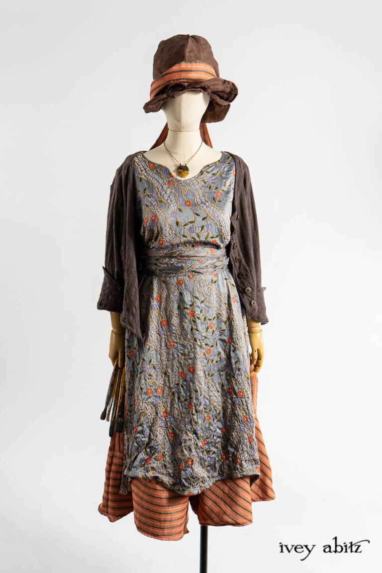 Libert&eacute; Jacket in Realism Embroidered Stripe Knit; Nook Frock in Raphaelite Embroidered Washed Silk; Porte Cochere Sash in Raphaelite Embroidered Washed Silk; Cossart Culottes in Fauvist Raised Stripe Weave; Fitz Necktie in Fauvist Raised Stripe Weave; Hapgood Hat in Realism Crushed Weave; Renaissance Necklace.