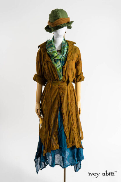 Vanetten Duster Coat in Medieval Washed Voile; Chomley Wrap in Bauhaus Washed Plaid Gauze; Nook Frock in Expressionism Washed Voile; Cilla Slip Frock in Dada Silkiest Knit; Hapgood Hat in Renaissance Saturated Weave; Ettienne Sash in Medieval Wispy Woven Silk; Renaissance Necklace.