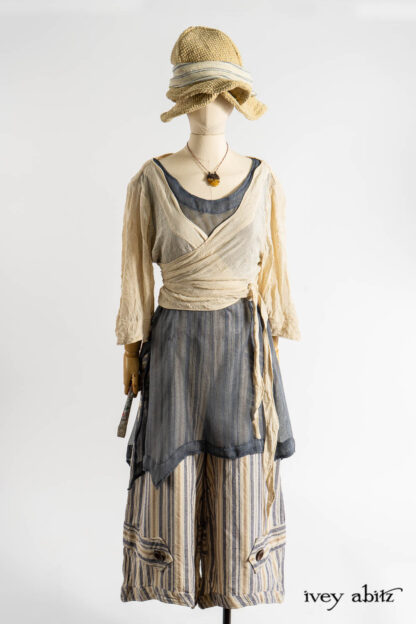 Vallonné Jacket in Baroque Crushed Netted Knit; Bedloe Frock in Academic Breezy Weave; Cilla Camisole in Dada Silkiest Knit; Camilla Trousers in Academic Woven Stripe; Hapgood Hat in Ancient Rustic Silk Weave; Clotaire Sash in Academic Rustic Stripe; Renaissance Necklace.