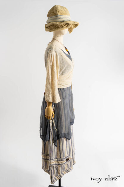 Vallonné Jacket in Baroque Crushed Netted Knit; Bedloe Frock in Academic Breezy Weave; Cilla Camisole in Dada Silkiest Knit; Camilla Trousers in Academic Woven Stripe; Hapgood Hat in Ancient Rustic Silk Weave; Clotaire Sash in Academic Rustic Stripe; Renaissance Necklace.