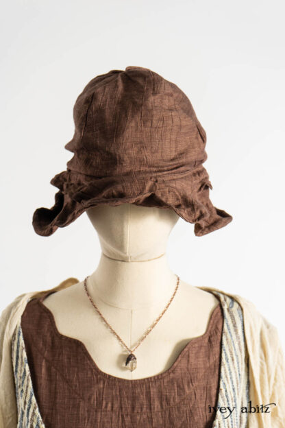 Bartholdi Frock in Realism Crushed Weave; Ellis Frock in Academic and Realism Rustic Stripe; Bartholdi Frock in Realism Crushed Weave; Vallonné Jacket in Baroque Crushed Netted Knit; Hapgood Hat in Realism Crushed Weave; Nouvelle Necklace.