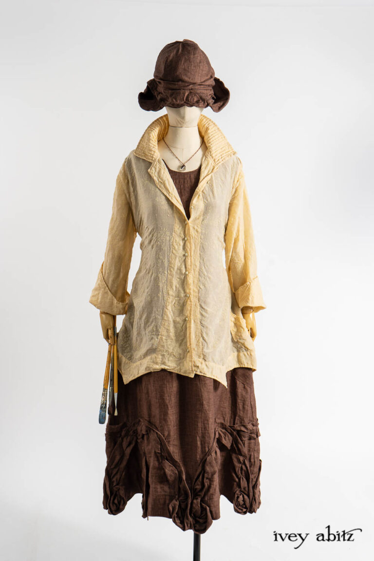 Ellis Shirt in Baroque Flocked Floral Voile; Bartholdi Frock in Realism Crushed Weave; Hapgood Hat in Realism Crushed Weave; Nouvelle Necklace.