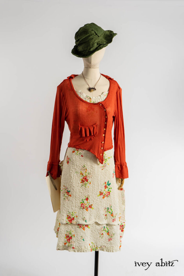 Cozette Cardigan in Fauvist Ethereal Knit; Hapgood Hat in Renaissance Saturated Weave; Harrison Frock in Impressionism Floral Puckered Stretch Weave; Renaissance Necklace.