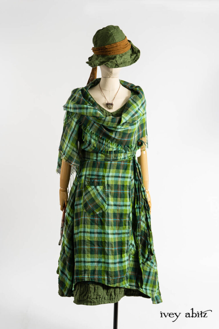 Chomley Frock in Bauhaus Washed Plaid Gauze; Chomley Wrap in Bauhaus Washed Plaid Gauze; Hapgood Hat in Renaissance Saturated Weave; Vanetten Sash in Medieval Wispy Woven Silk; Renaissance Necklace; Manor Frock in Renaissance Saturated Weave.