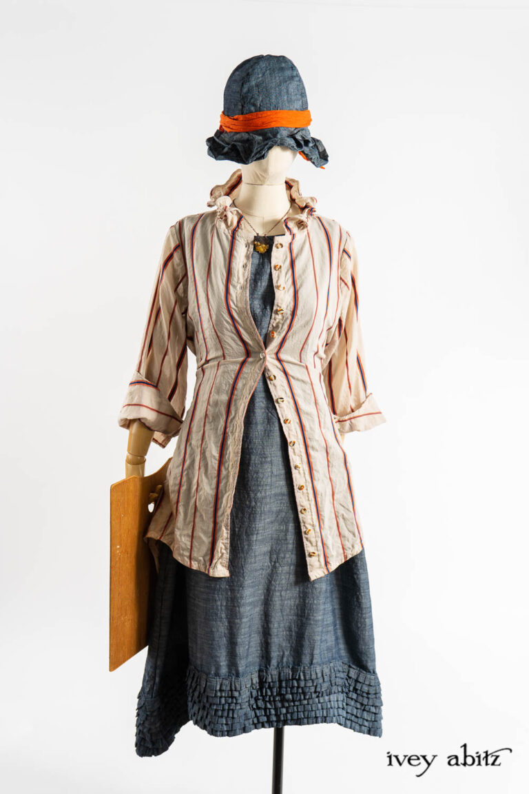 Grasmere Shirt in Fauvist and Academic Stripe Voile; Thatched Frock in Academic Finest Everyday Weave; Nouvelle Necklace; Hapgood Hat in Academic Finest Everyday Weave; Clotaire Sash in Fauvist Washed Voile.