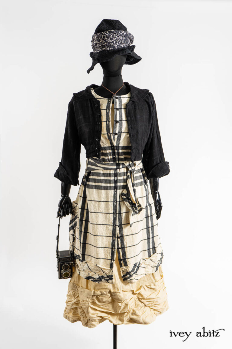 Beacon Jacket in Post Modern Puckered Wispy Weave; Mewland Vest in Post Modern Bold Puckered Plaid; Fitzgerald Frock in Baroque Textured Stretch Weave; Hapgood Hat in Post Modern Puckered Wispy Weave; Eleanora Sash in Post Modern Floral Ethereal Weave; Nouvelle Necklace;