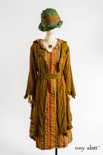 Vanetten Frock in Medieval Puckered Stripe; Vanetten Duster Coat in Medieval Washed Voile; Ettienne Sash in Medieval Wispy Woven Silk; Hapgood Hat in Renaissance Saturated Weave; Renaissance Necklace.