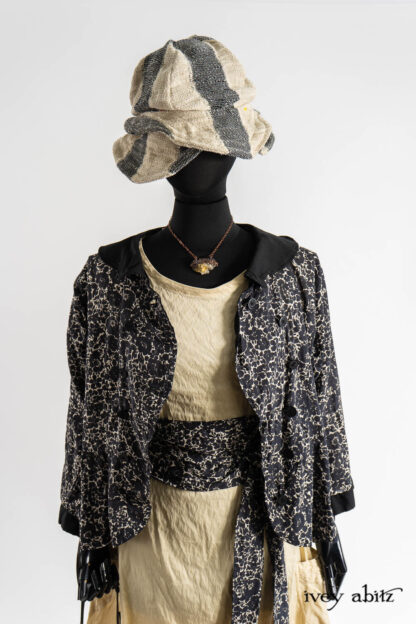 Sennen Jacket in Post Modern Floral Ethereal Weave; Hapgood Hat in Post MOdern Old World Stripe; Renaissance Necklace; Eleanora Sash in Post Modern Floral Ethereal Weave; Fitzgerald Frock in Baroque Textured Stretch Weave.