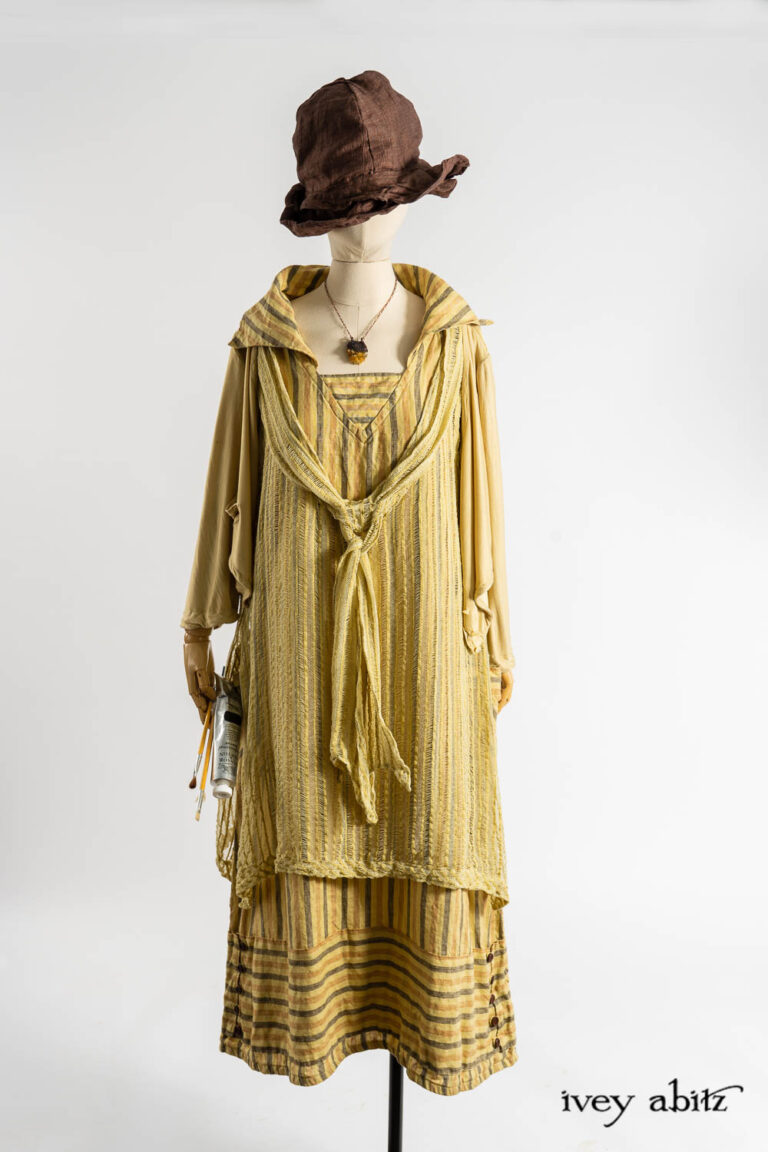 Elliot Jacket in Baroque Silkiest Knit; Ettienne Frock in Dada Embroidered Stripe Knit; Ettienne Sash in Dada Embroidered Stripe Knit; Viv Frock in Dada Washed Stripe Linen; Hapgood Hat in Realism Crushed Weave; Renaissance Necklace.