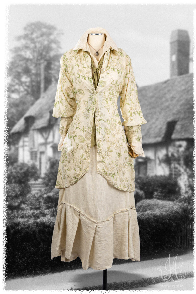 Ivey Abitz Summer 2025 Look 1 Truitt Shirt Jacket in Garden Floral Washed Weave; Truitt Shirt in Cottage Cream Pintucked Voile; Fitz Necktie in Garden Washed Voile; Fairholme Skirt in Cottage Cream Rustic Weave; Nouvelle Necklace.
