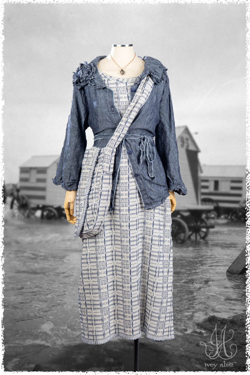 Ivey Abitz Summer 2025 Look 22 Celia Shirt in Seaside Washed Weave; Limited Edition Reversible Covante Frock in Cottage Cream Embroidered Plaid; Limited Edition Reversible Solomon Bag; Cottage Cream Embroidrered Plaid; Nouvelle Necklace.