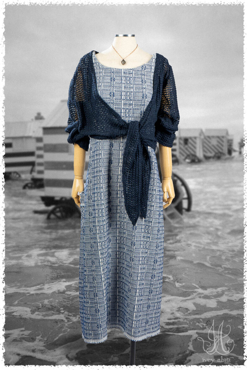 Ivey Abitz Summer 2025 Look 26 Wright Cardigan in Seaside Open Weave Knit; Limited Edition Reversible Covante Frock in Seaside Embroidered Plaid; Nouvelle Necklace.