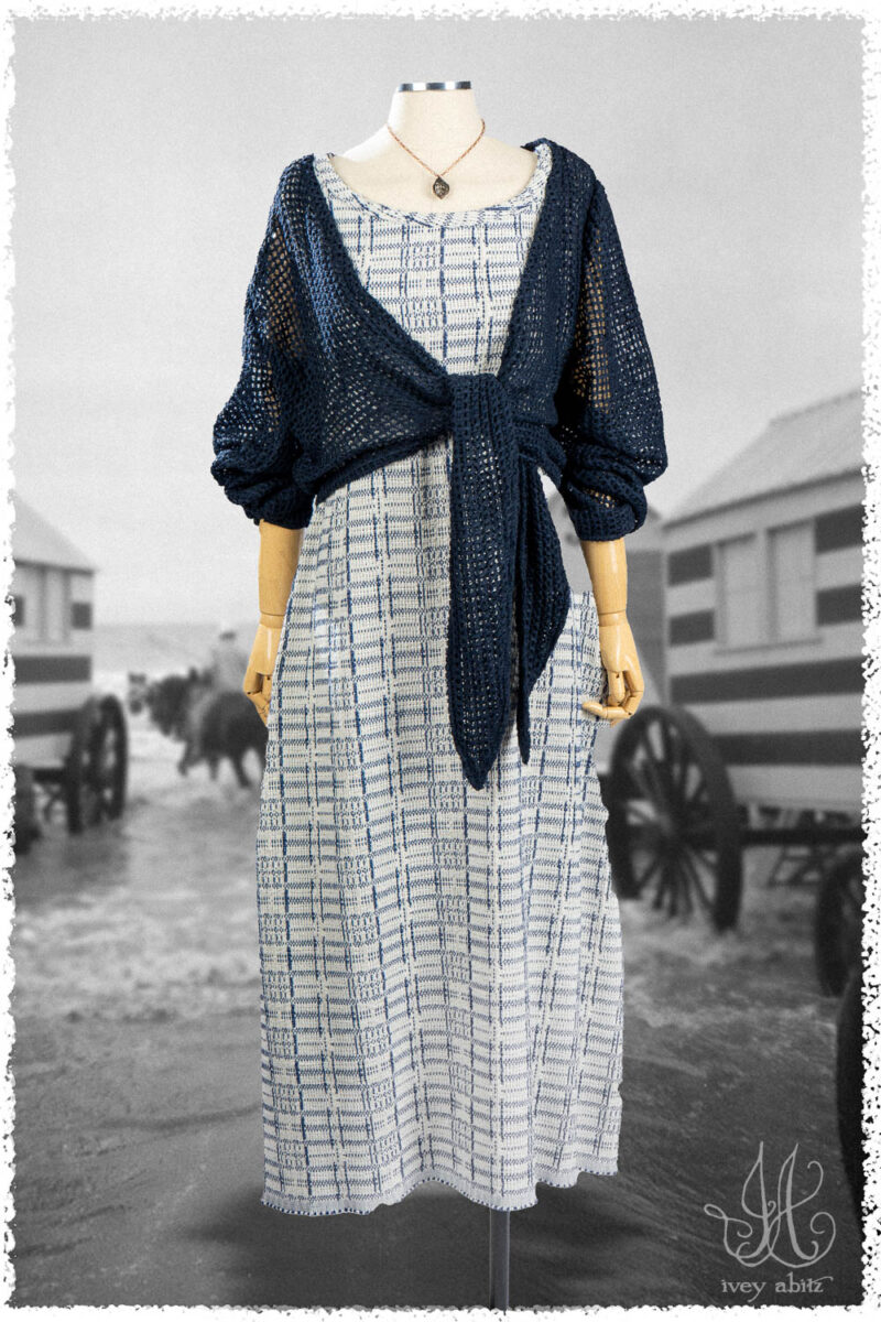 Ivey Abitz Summer 2025 Look 27 Wright Cardigan in Cottage Open Weave Knit; Limited Edition Reversible Covante Frock in Cottage Cream Embroidered Plaid; Nouvelle Necklace.