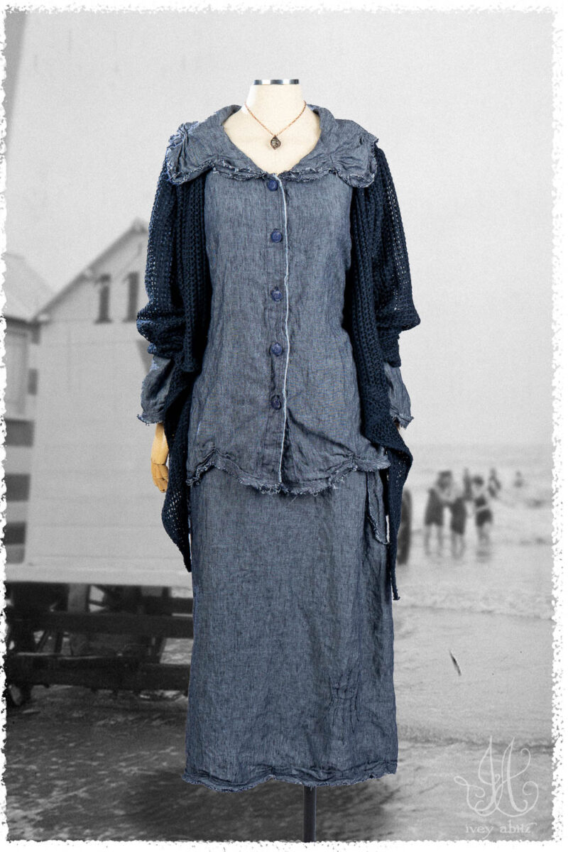 Ivey Abitz Summer 2025 Look 28 Celia Shirt in Seaside Washed Weave; Celia Skirt in Seaside Washed Weave; Cilla Slip Frock in Everyday Ribbed Knit; Wright Cardigan in Seaside Open Weave Knit; Nouvelle Necklace.
