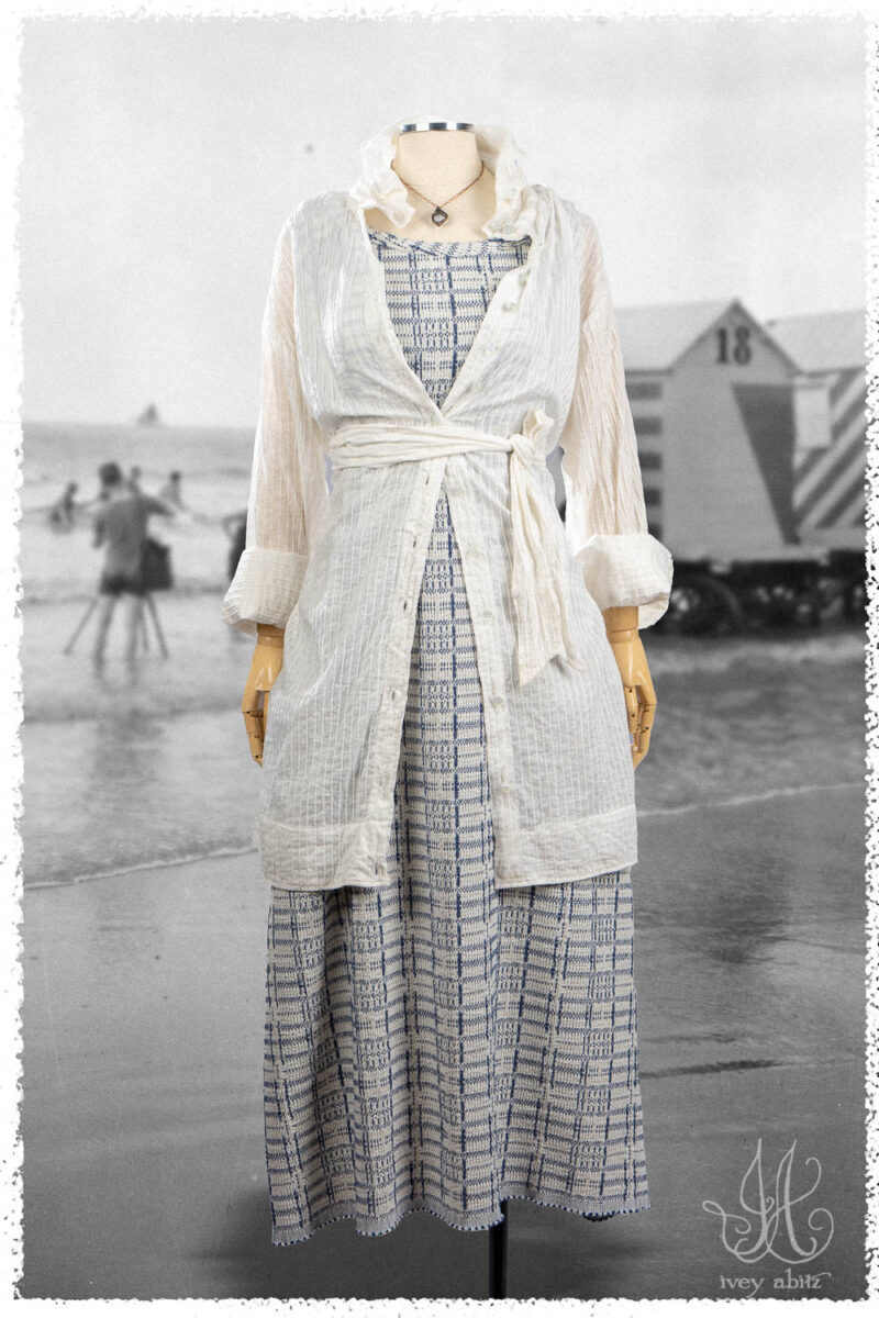 Ivey Abitz Summer 2025 Look 30 Vanetten Shirt in Signature Everyday Pintucked Voile; Limited Edition Reversible Covante Frock in Cottage Cream Embroidered Plaid; Nouvelle Necklace.