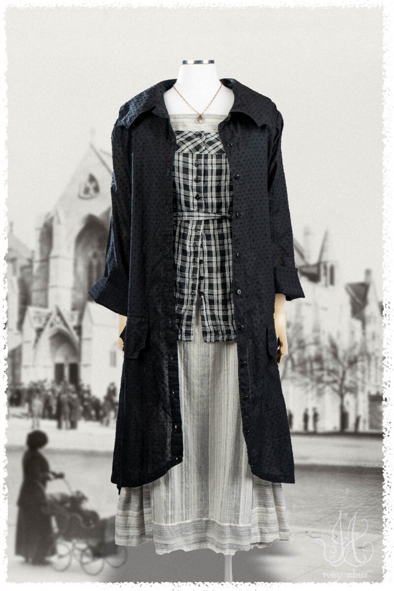 Ivey Abitz Summer 2025 Look 40 Roycroft Duster Coat in Black Dotted Check Voile; Roycroft Vest in Black and White Soft Plaid; Roycroft Frock in Black and White Variegated Washed Stripe; Nouvelle Necklace.