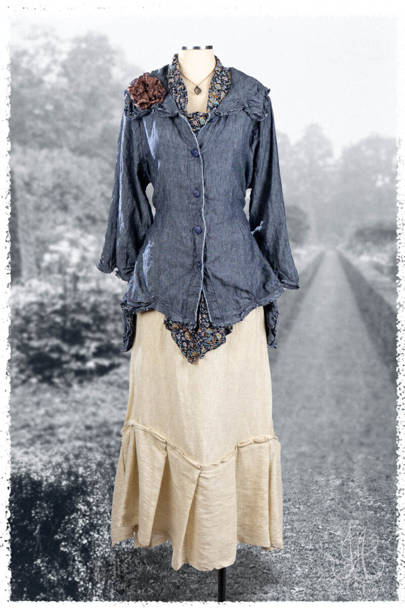 Ivey Abitz Summer 2025 Look 46 Celia Shirt in Seaside Washed Weave; Fairholme Sash in Voyage Floral Crinkled Chiffon; Fairholme Skirt in Cottage Cream Rustic Weave; Bartholdi Brooch in Voyage Washed Weave; Nouvelle Necklace.