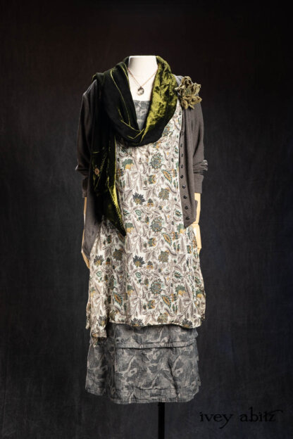 Baedeker Scarf (Long) in Olive Quartz Silk Velvet; Bonheur Brooch in Olive Quartz Sculpted Felt; Ettienne Frock in Olive Quartz Floral Silk Chiffon; Nouvelle Necklace; Limited Edition Gilbert Cardian in Earth and Iron Petite Stripe Knit; Harrison Frock in Pewter and Stone Floral Linen. - Bespoke clothing by Ivey Abitz.