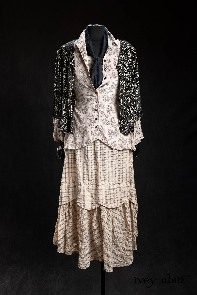 Truitt Shirt in Pearl Floral Crepe de Chine; Fitz Necktie in Black Diamond Embroidered Daisy Voile; Heraldry Frock in Pearl Puckered Plaid; Tilly Cardigan in Pearl and Black Diamond Velvet Knit; Essentielle Frock in Signature Black Washed Silk Jersey Knit. - Bespoke clothing by Ivey Abitz.