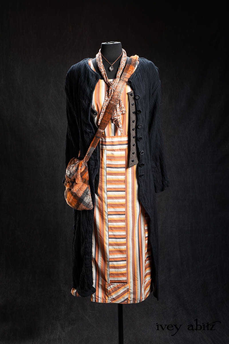 Limited Edition Gilbert Cardigan in Earth and Iron Petite Stripe Knit; Highlands Sash in Copper Petite Fleur Knit; Campanella Frock in Copper Striped Poplin; Nouvelle Necklace; Maplehurst Duster Coat in Black Diamond Double Crinkle Stretch Voile; Voyage Satchel in Copper Argyle Knit. - Bespoke clothing by Ivey Abitz.