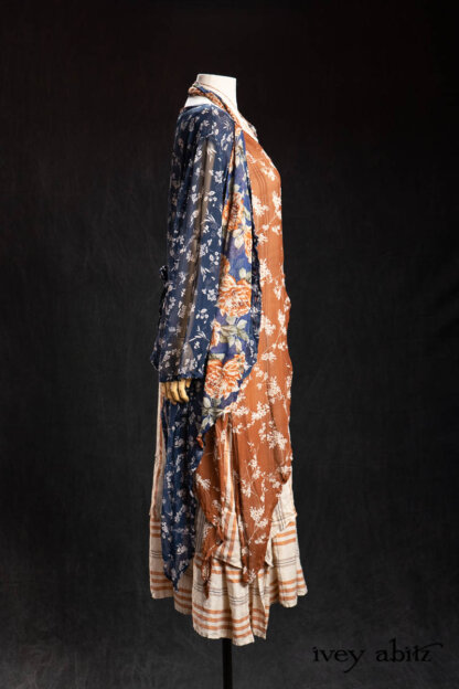 Lumiere Jacket in Blue Kyanite Petite Floral Silk Chiffon; Lumiere Frock in Copper Petite Floral Silk Chiffon; Nouvelle Necklace; Fairholme Sash in Blue and Copper Floral Silk Chiffon; Heraldry Frock in Copper and Pearl Plaid. - Bespoke clothing by Ivey Abitz.