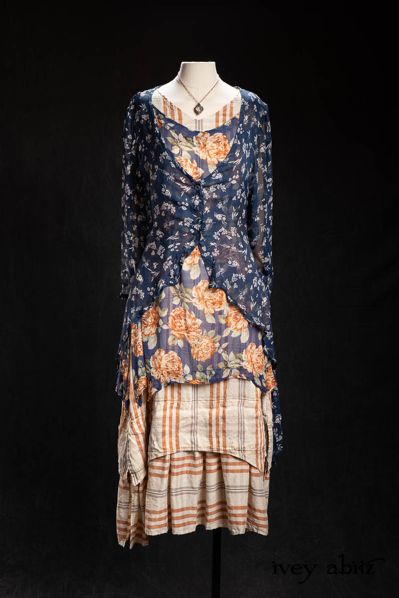 Lumiere Jacket in Blue Kyanite Petite Floral Silk Chiffon; Bedloe Frock in Blue and Copper Floral Silk Chiffon; Heraldry Frock in Copper and Pearl Plaid; Nouvelle Necklace. - Bespoke clothing by Ivey Abitz.