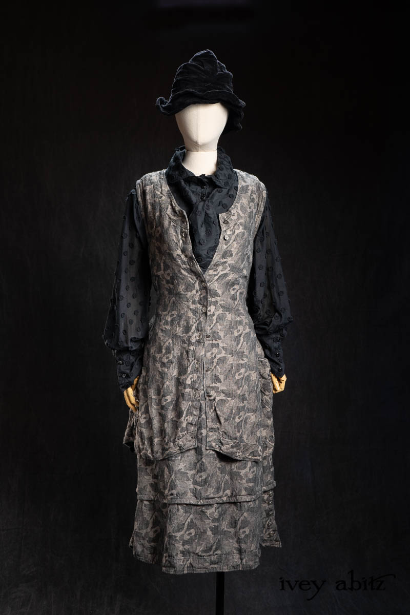Hapgood Hat in Black Diamond Crushed Velvet; Truitt Shirt Jacket in Black Diamond Embroidered Daisy Voile; Fitz Necktie in Black Diamond Embroidered Daisy Voile; Truitt Frock in Pewter and Stone Floral Linen; Harrison Frock in Pewter and Stone Floral Linen. - Bespoke clothing by Ivey Abitz.