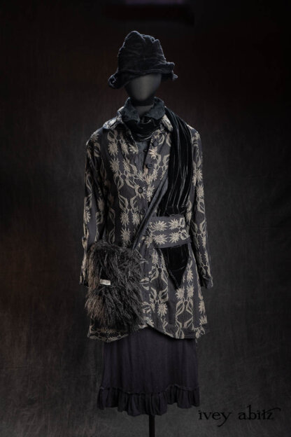 Montague Coat in Floral and Fauna Brocade; Baedeker Scarf (Petite) in Black Diamond Silk Velvet; Truitt Shirt Jacket in Black Diamond Embroidered Daisy Voile; Voyage Satchel in Black Diamond Faux Fur; Essentielle Frock in Signature Black Washed Silk Jersey Knit; Hapgood Hat in Black Diamond Crushed Velvet. - Bespoke clothing by Ivey Abitz.