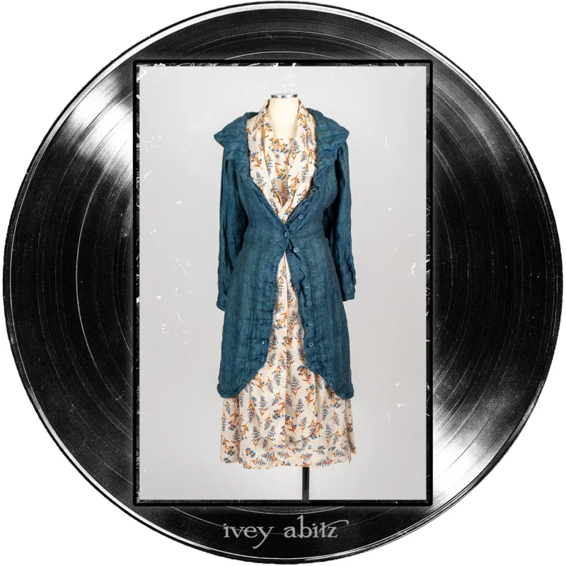 Arthur Hill Duster Coat in Far Beyond Forever Woven Weave; Roycroft Frock in Far Beyond Forever Floral Weave; Blanchefleur Sash in Far Beyond Forever Floral Weave.