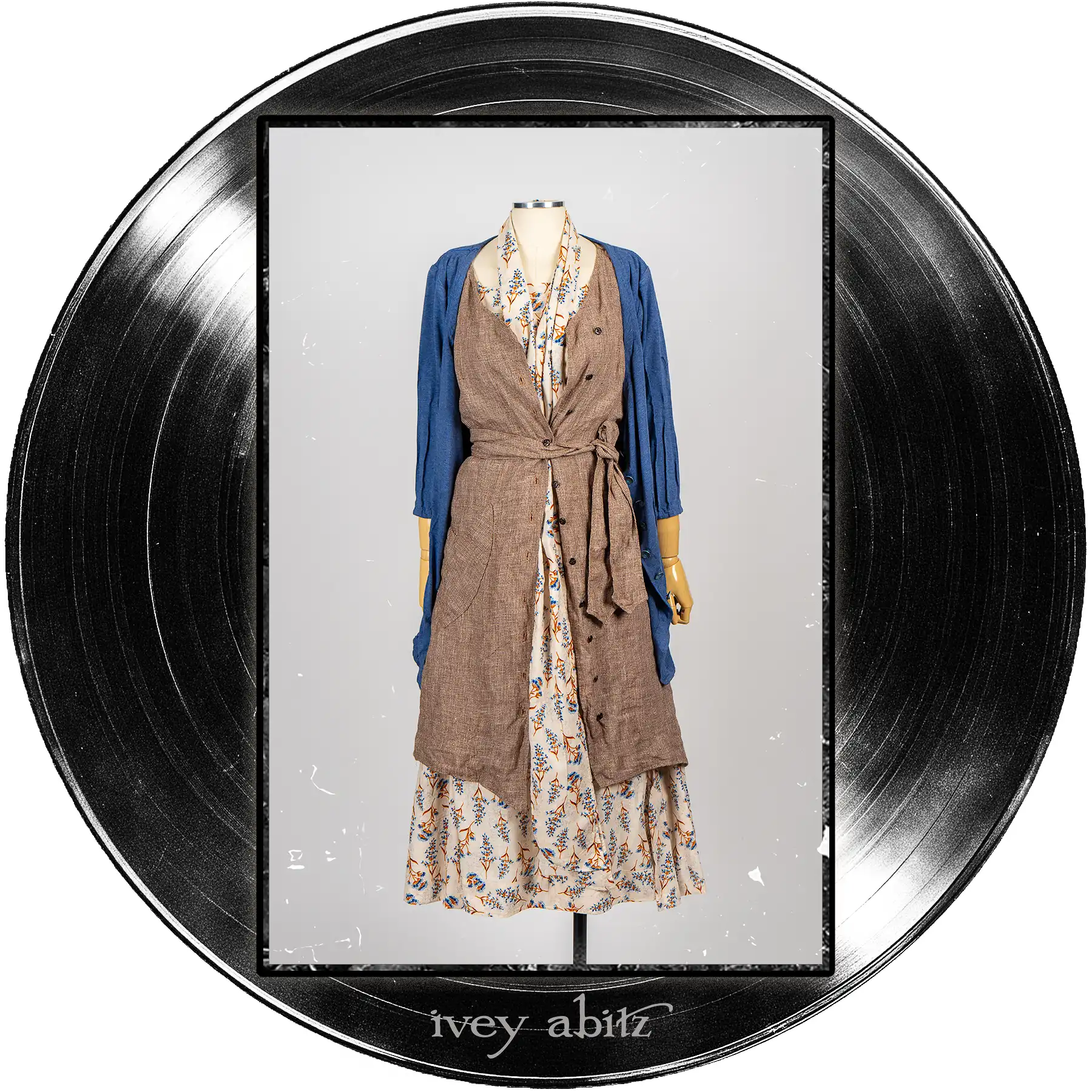 Gweneviere Cardigan in Far Beyond Forever Heathered Knit; Ellis Frock in Record Case Speaker Weave; Roycroft Frock in Far Beyond Forever Floral Weave; Blanchefleur Sash in Far Beyond Forever Floral Weave.