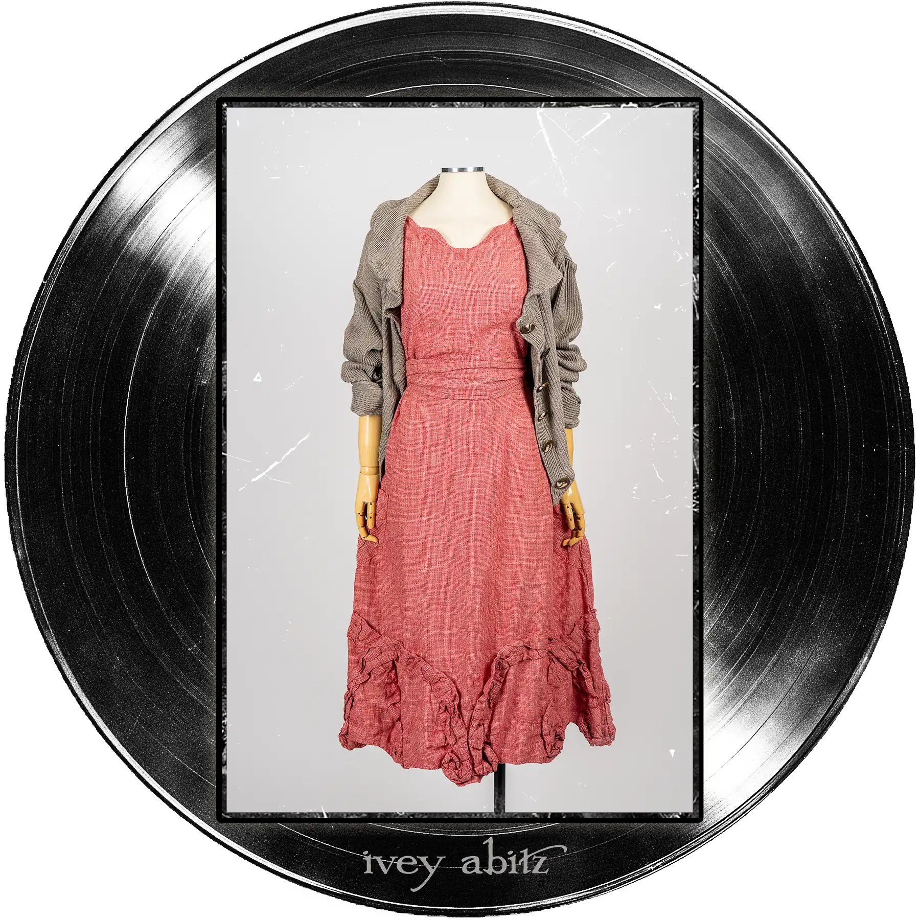 Jem Cardigan in Record Case Accordion Knit; Bartholdi Frock in Center Label Speaker Weave; Clotaire Sash in Center Label Speaker Weave.