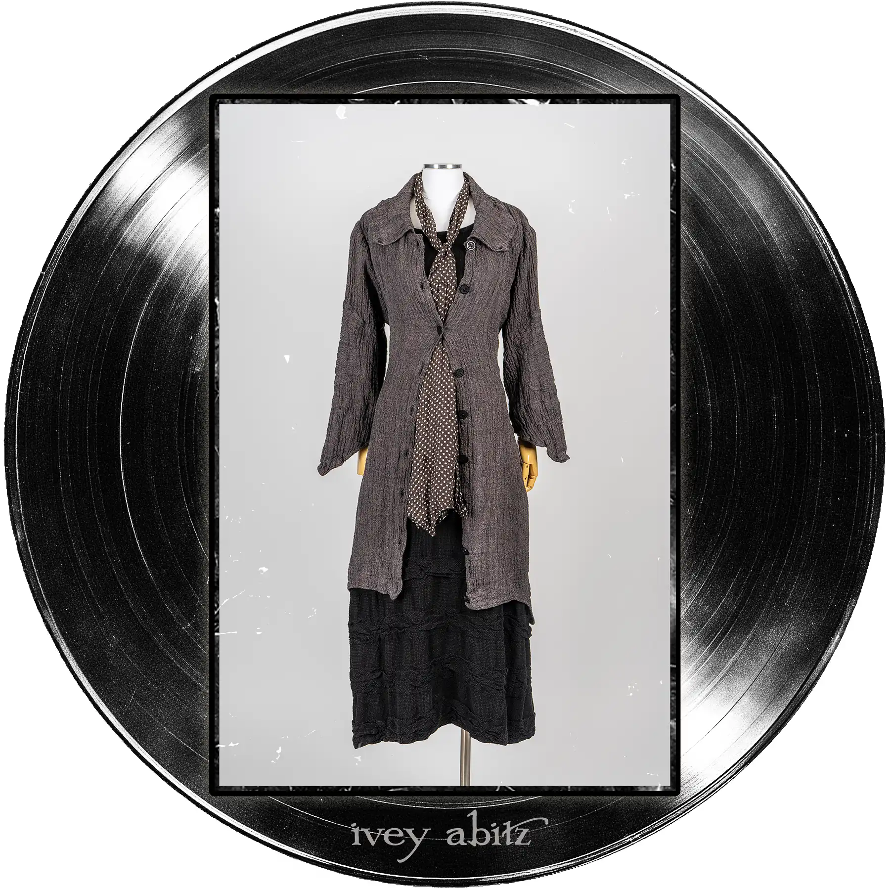 Chittister Duster Coat in Microphone and Record Case Washed Crinkled Weave; Harbourhill Tie in Microphone Dotted Silk Chiffon; Bertie Frock in Quarter Note Washed Check Weave.