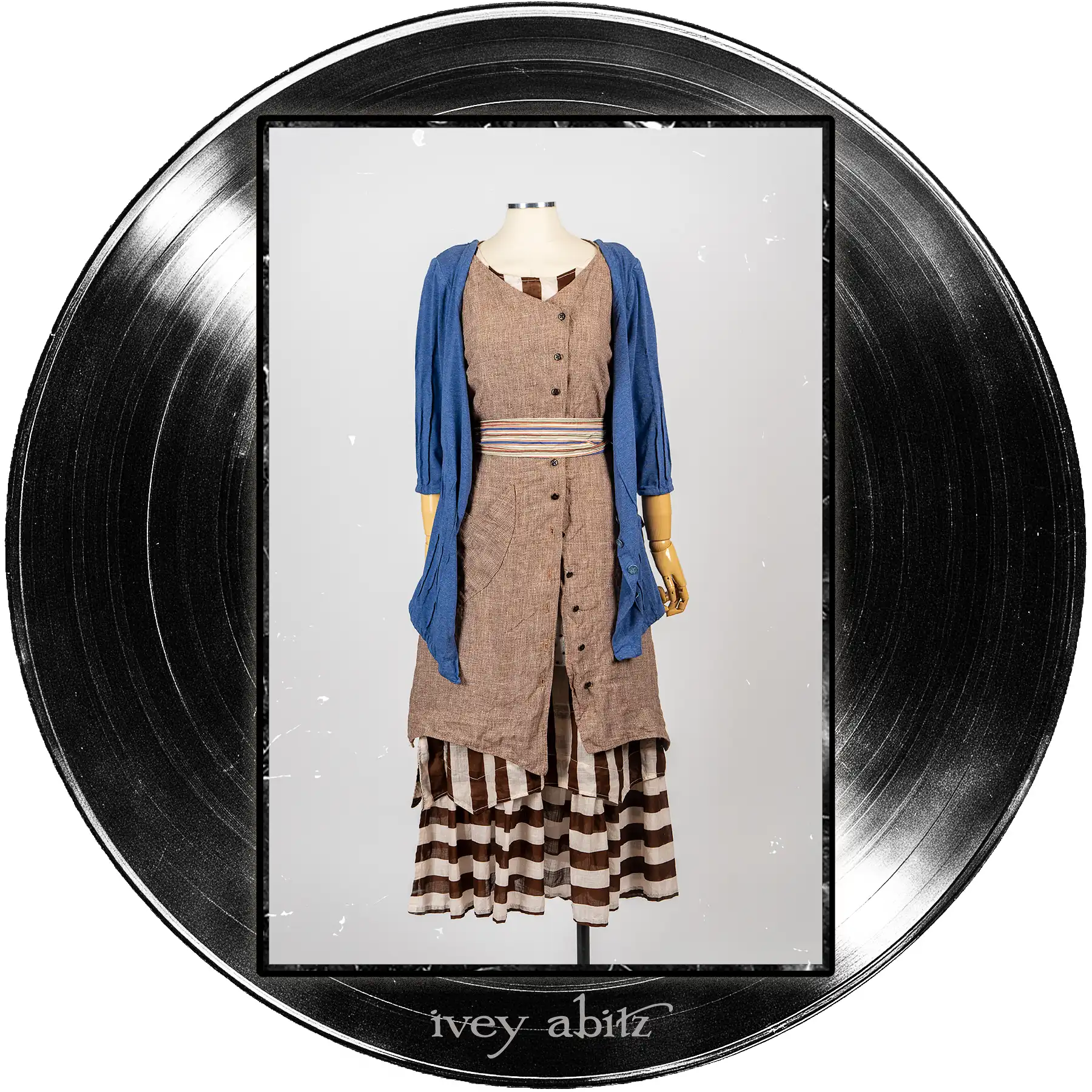 Gweneviere Cardigan in Far Beyond Forever Heathered Knit; Camborne Sash in Far Beyond Forever Stripe; Ellis Frock in Record Case Speaker Weave; Liberté Frock in Record Case Stripe Voile.