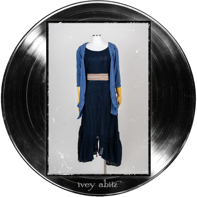 Gweneviere Cardigan in Far Beyond Forever Heathered Knit; Camborne Sash in Far Beyond Forever Stripe; Pippi Frock in Blue Note Washed Crinkled Weave.