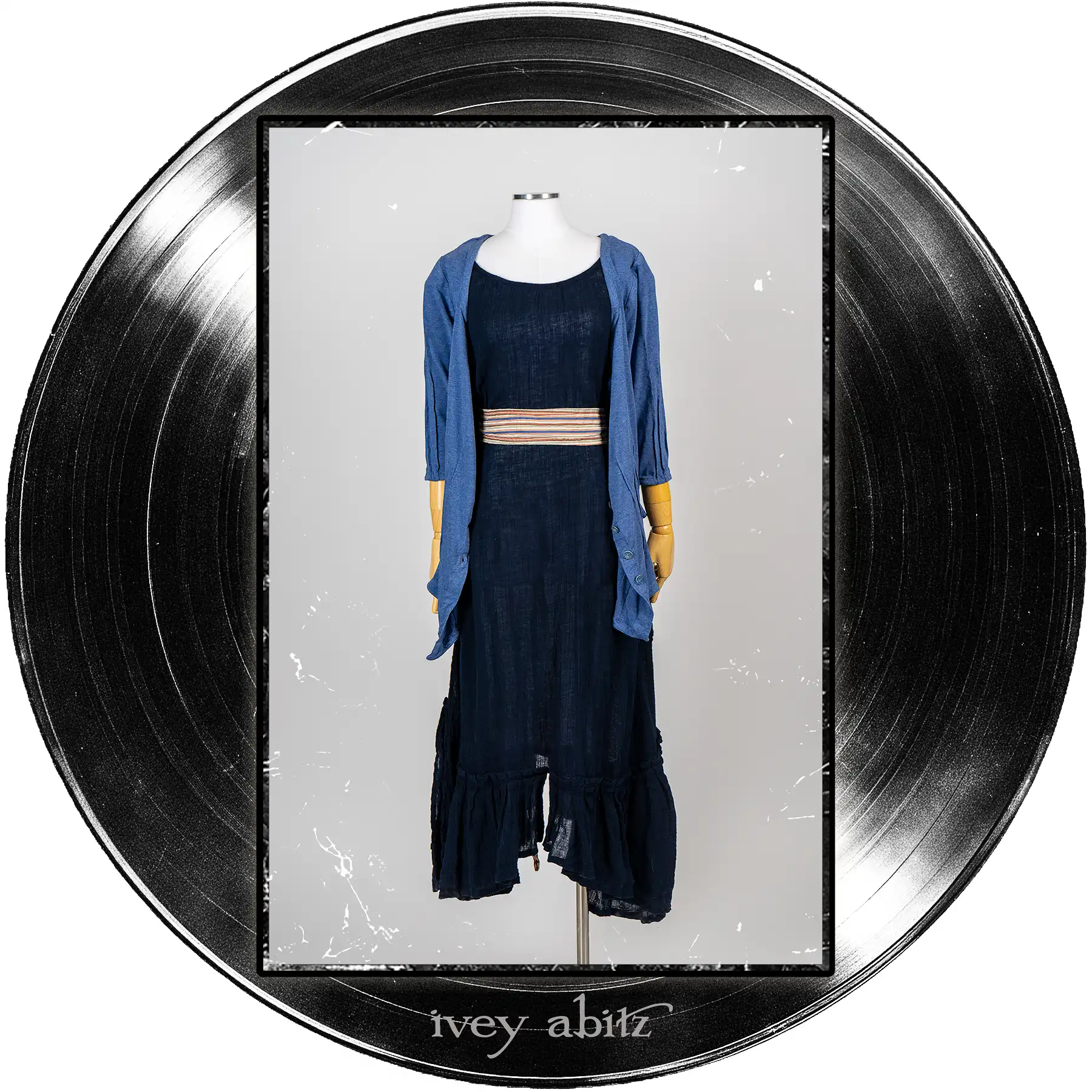 Gweneviere Cardigan in Far Beyond Forever Heathered Knit; Camborne Sash in Far Beyond Forever Stripe; Pippi Frock in Blue Note Washed Crinkled Weave.