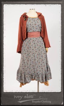 Bertie Jacket in New Sun Softest Knit; Floravinea Brooch in Rosy Washed Crinkled Linen; Tilbrook Frock in Fresh Water Floral Weave; Edenshire Frock in New Sun Washed Linen in High Water Length; Porte Cochere Sash in Rosy Washed Cotton. By Ivey Abitz.