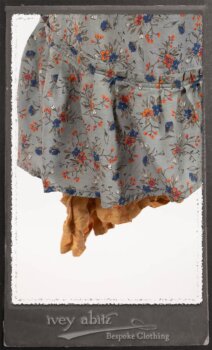 Bertie Jacket in New Sun Softest Knit; Floravinea Brooch in Rosy Washed Crinkled Linen; Tilbrook Frock in Fresh Water Floral Weave; Edenshire Frock in New Sun Washed Linen in High Water Length; Porte Cochere Sash in Rosy Washed Cotton. By Ivey Abitz.