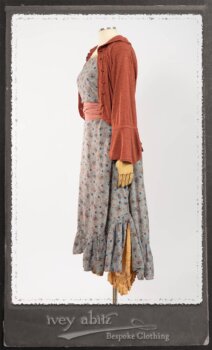 Bertie Jacket in New Sun Softest Knit; Floravinea Brooch in Rosy Washed Crinkled Linen; Tilbrook Frock in Fresh Water Floral Weave; Edenshire Frock in New Sun Washed Linen in High Water Length; Porte Cochere Sash in Rosy Washed Cotton. By Ivey Abitz.