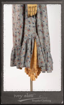 Bertie Jacket in New Sun Softest Knit; Floravinea Brooch in Rosy Washed Crinkled Linen; Tilbrook Frock in Fresh Water Floral Weave; Edenshire Frock in New Sun Washed Linen in High Water Length; Porte Cochere Sash in Rosy Washed Cotton. By Ivey Abitz.