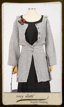 Campanella Shirt Jacket in Black and White Petite Stripe Linen; Bertie Frock in Black Puckered Check Weave; Cilla Slip Frock in Signature Black Lightweight Linen Knit; Floravinea Brooch in Rosy Washed Crinkled Linen. By Ivey Abitz.