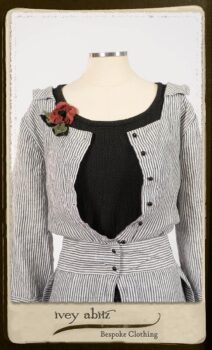 Campanella Shirt Jacket in Black and White Petite Stripe Linen; Bertie Frock in Black Puckered Check Weave; Cilla Slip Frock in Signature Black Lightweight Linen Knit; Floravinea Brooch in Rosy Washed Crinkled Linen. By Ivey Abitz.