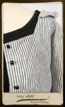 Campanella Shirt Jacket in Black and White Petite Stripe Linen; Bertie Frock in Black Puckered Check Weave; Cilla Slip Frock in Signature Black Lightweight Linen Knit; Floravinea Brooch in Rosy Washed Crinkled Linen. By Ivey Abitz.